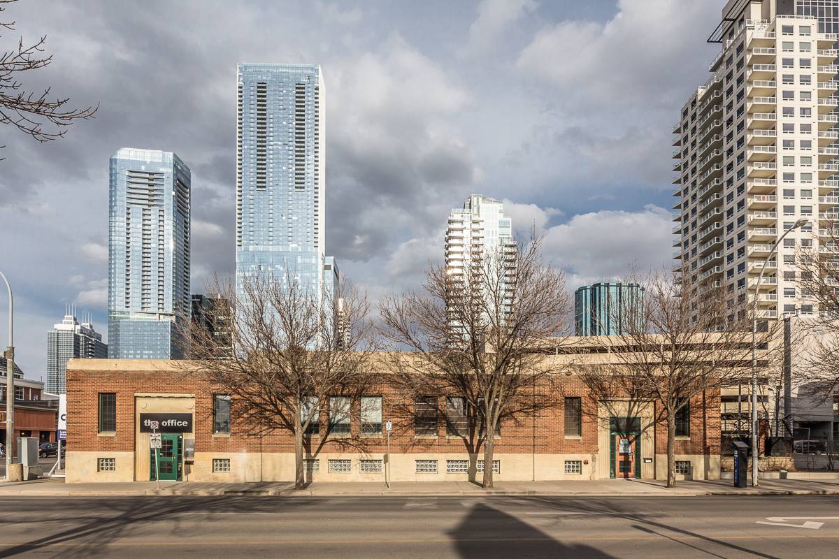Brick building with skyscrapers in background