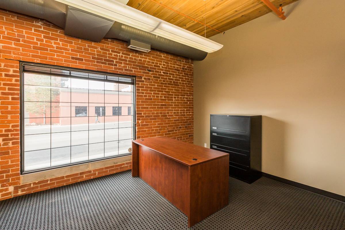 Minimalist office with wooden desk