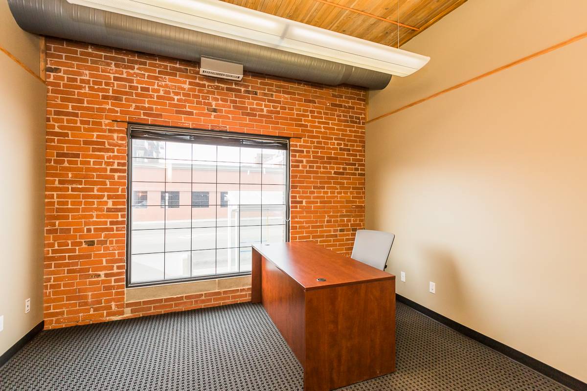Minimalist office with wooden desk