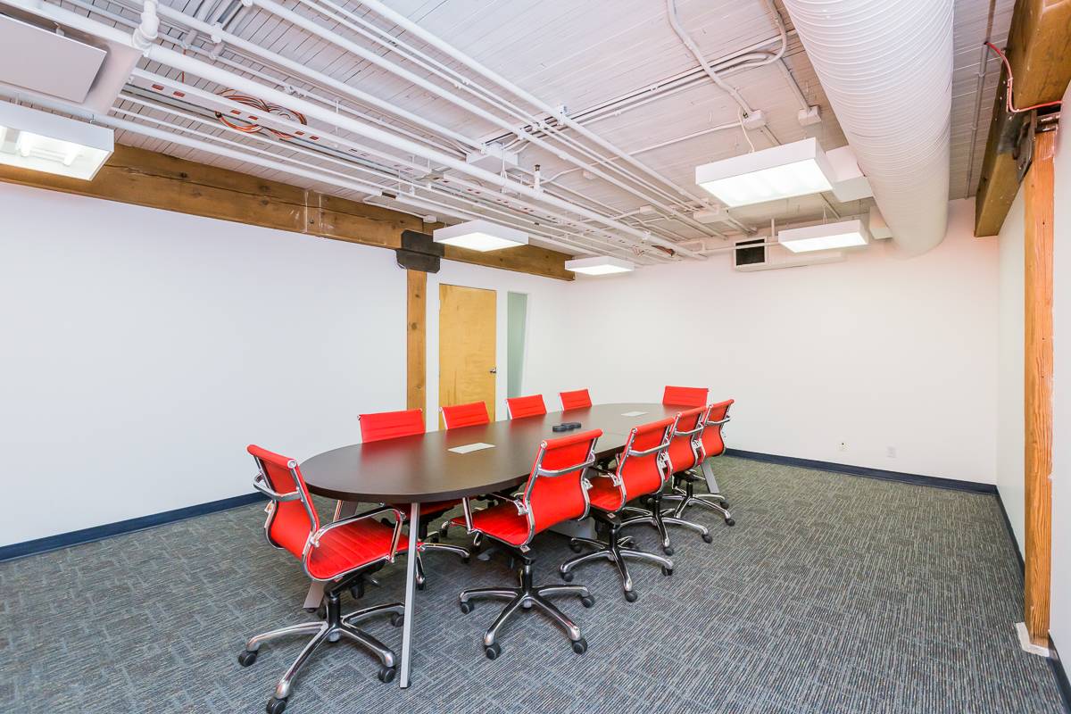 Office room with bright red seating