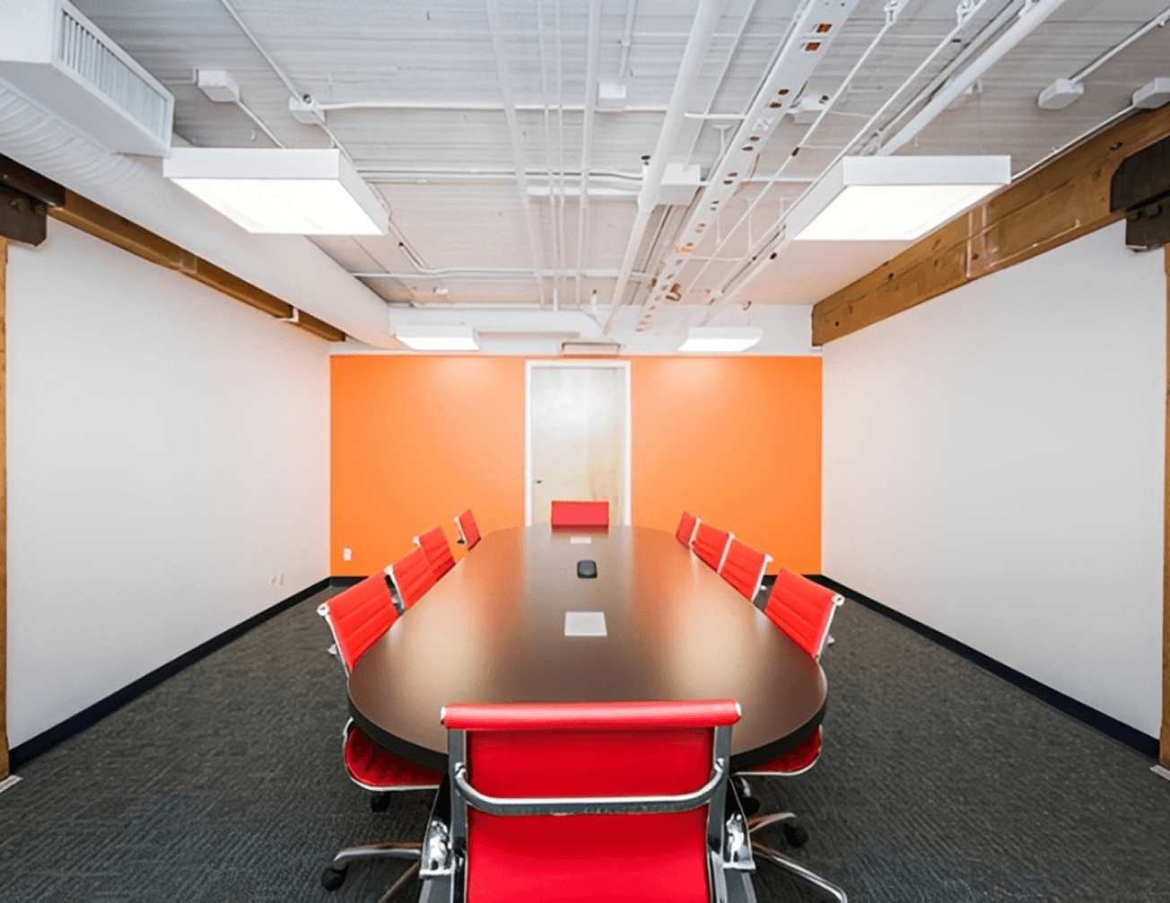 Bright office space with orange wall